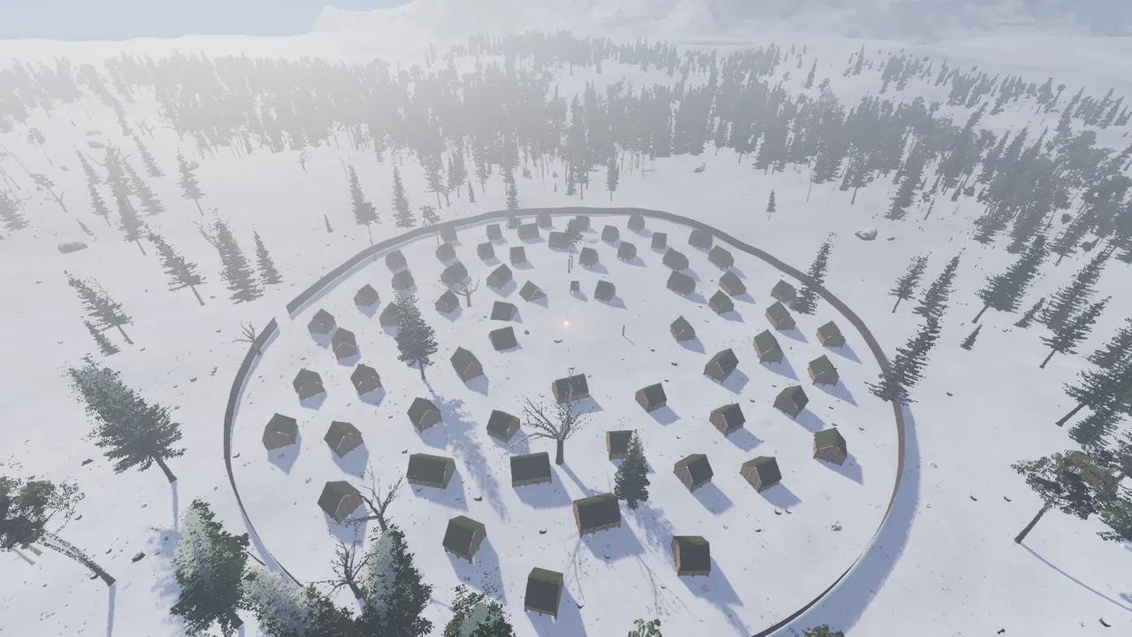 Ein Dorf im Schnee von oben, umgeben von einem runden Zaun.
